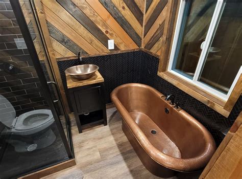 26ft man cave tiny house s luxe interior boasts copper accents