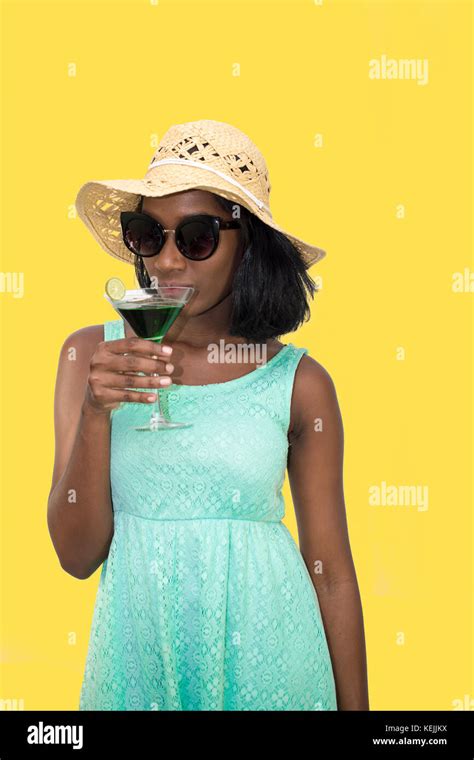 Woman Sips Cocktail Drink Stock Photo Alamy
