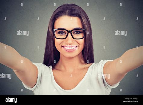 Closeup Of A Young Beautiful Woman In Glasses Taking Selfie Isolated