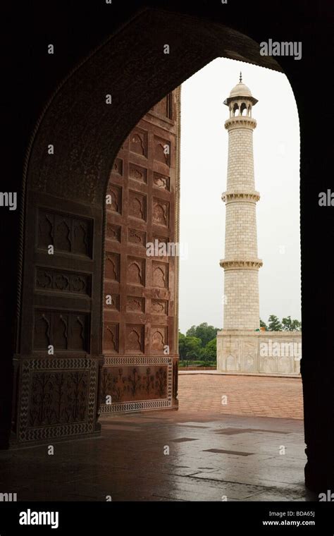 Minaret At The Taj Mahal Mausoleum Seen Through An Arched Passageway
