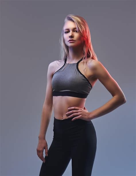 Free Photo Sexy Slim Blonde Girl In A Sportswear Posing In A Studio