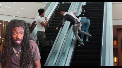 grabbing strangers cheeks on mall escalator reaction youtube