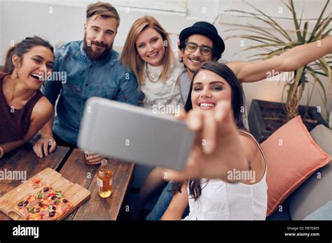 Multiracial People Having Fun At Party Taking A Selfie With Mobile Phone Group Of Young Friends
