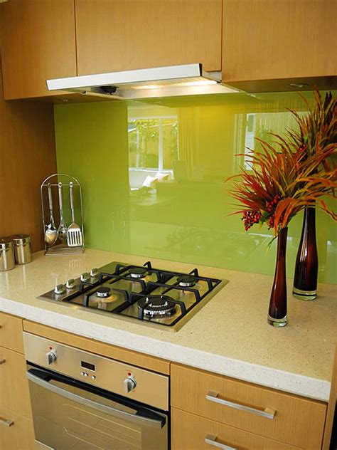 It is very easy to maintain like subway tiles. green glass kitchen backsplash - Decoist