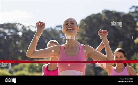 Female Athlete Crossing Finish Line Hi Res Stock Photography And Images