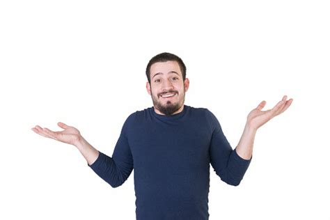 Portrait Of Shrugging Young Man On A White Background Stock Photo