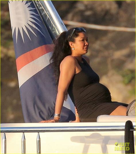 Kimora Lee Simmons Shows Off Her Growing Baby Bump On Vacation Photo