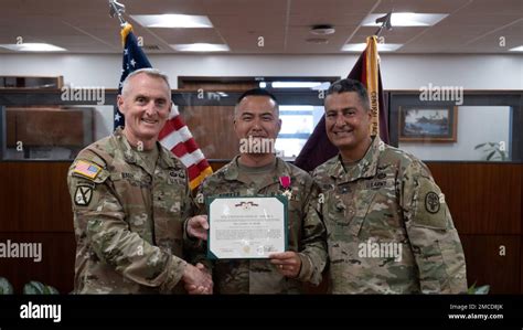 Pictured Center Command Sgt Maj Anthony Forker Jr Receives Legion