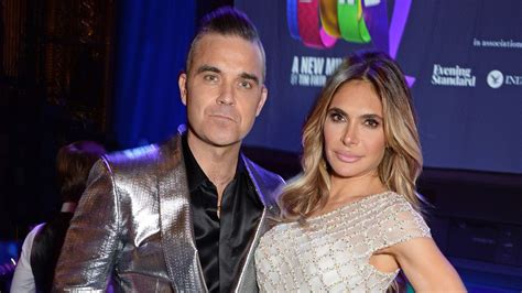 robbie williams and wife ayda field say they were threatened with being beheaded during haiti