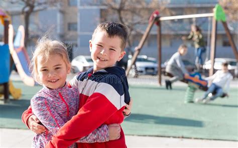 portrait of brother and sister at the playground stock image image of european outdoors