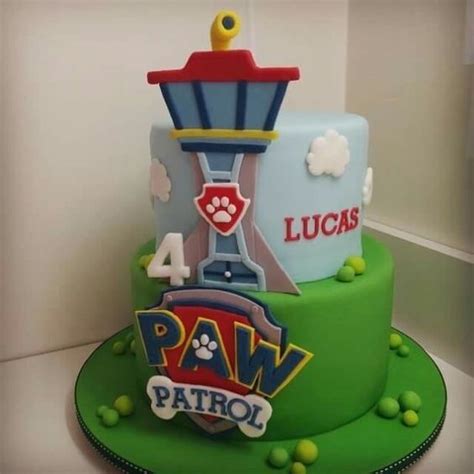 Maybe you would like to learn more about one of these? Pastel redondo de dos niveles decorado con torre y logo de ...