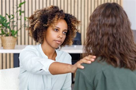 African American Female Psychologist Conducts An Appointment With A