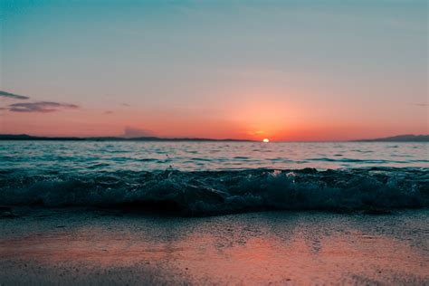 Scenic of Ocean During Sunset · Free Stock Photo