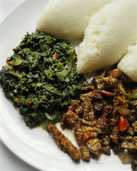 Zambian Lunch Nshima With Pumpkin Leaves And Mopani Worms African