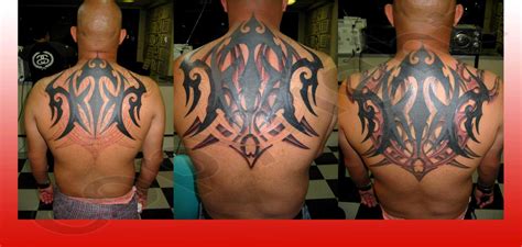 Shoulder armor tattoo with colored insignia. payfusloder: body armor tattoo