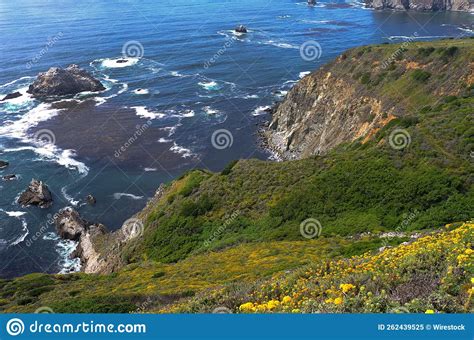 Aerial Shot Of The Big Sur Cliff In California With Waves Hitting The