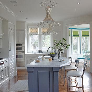 A gorgeous skylight above the sink area lets in natural light to brighten the small kitchen. width=850″ height=565″ /> the island in this kitchen is a breakfast bar with a lower working surface on the kitchen side. Curved Island Countertop Design Ideas