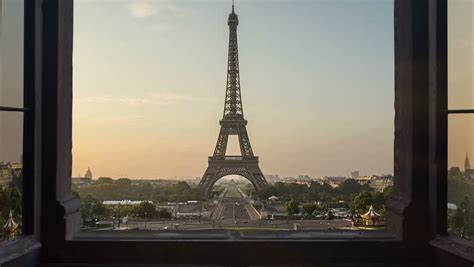 View Of Eiffel Tower From Far Away In Paris France With Moving Clouds