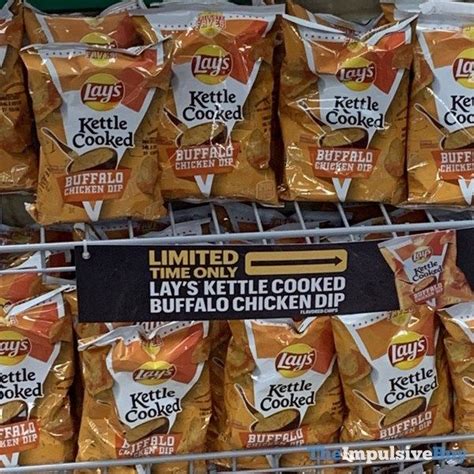 Several Bags Of Chips Are On Display In A Store