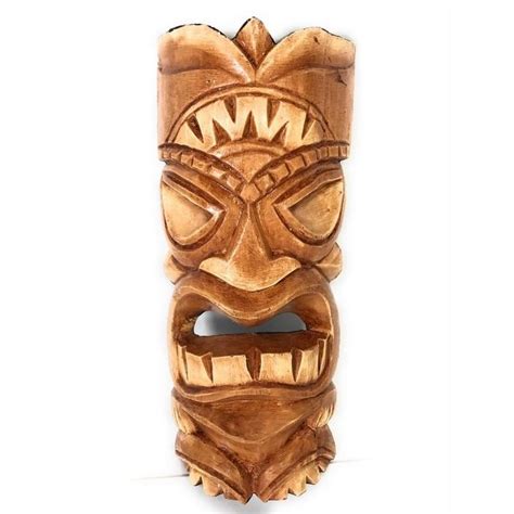 A Carved Wooden Mask On A White Background