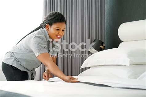 Maid Making Bed In Hotel Room Staff Maid Making Bed African Maid