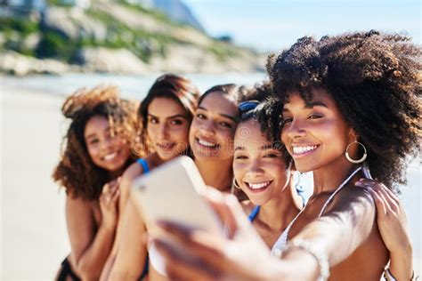 Its Not Summer Without Some Fun Memories A Group Of Happy Young Women Taking Selfies Together