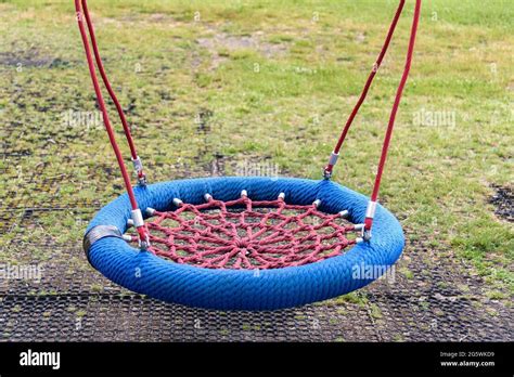 Modern Empty Swing Made Of Ropes On The Playground Stock Photo Alamy