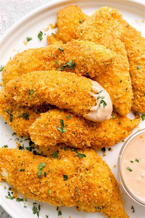Pat the chicken thighs dry and place them on the baking sheet. Baked Chicken Tenders (Crispy Cornflake Crust) - Easy ...