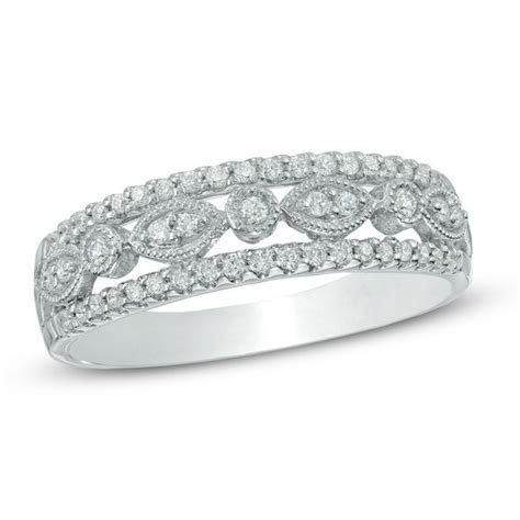 Maybe you would like to learn more about one of these? 1/5 CT. T.W. Diamond Anniversary Band in 10K White Gold ...