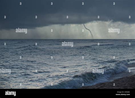 Storm Over The Sea With Tornado Stock Photo Alamy