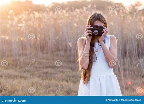Girl Holding A Camera Taking Pictures Stock Photo Image Of Front