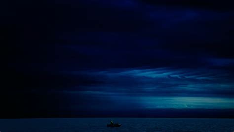 1360x768 Dark Evening Blue Cloudy Alone Boat In Ocean Desktop Laptop Hd
