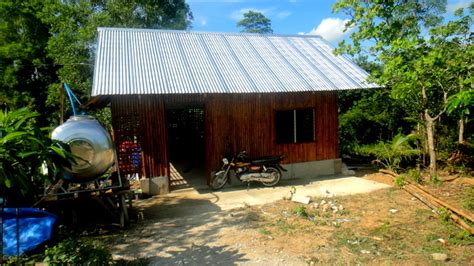 Biulding the bahay kubo is a community activity often assisted by family and. nipa hut in the philippines