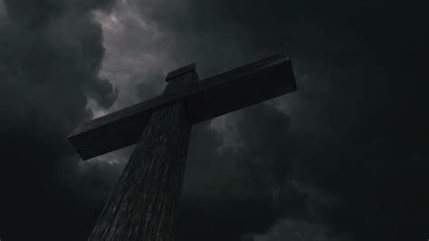 Three Crosses Are On Top Of A Hill Under A Dark Cloudy Sky Floodgate