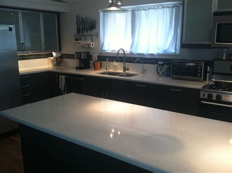 As a consumer, i put my trust into the company with the. Ikea Kitchen with white quartz countertops, subway tile ...