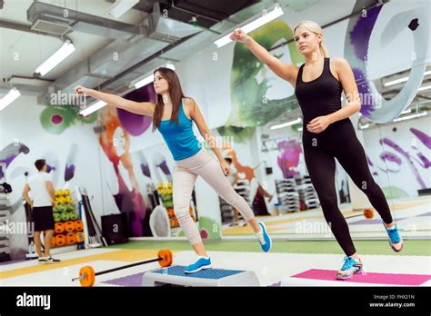 Beautiful Women Exercising Aerobics In Fitness Club Stock Photo Alamy