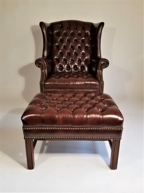This set is upholstered in a very hard to find leather with. Brown Leather Tufted Wingback Chair with Ottoman ...