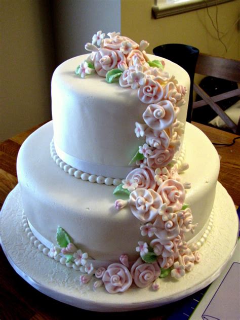 Decoration ideas of this beautiful canvas are literally endless. 2 Tiered Wedding Cake + Cupcakes + Mini Cakes - CakeCentral.com