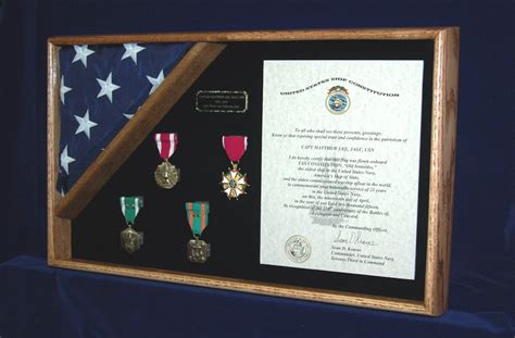 Military Medals In An Oak Framed Shadow Box With A Flag And Certificate