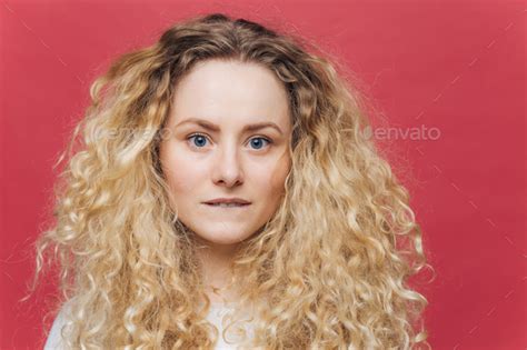 Headshot Of Beautiful Curly Blonde Female With Blue Eyes Healthy Skin