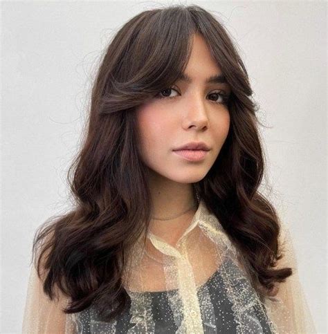30 trendy curtain bangs you ll be seeing everywhere in 2022 in 2022 haircuts for wavy hair