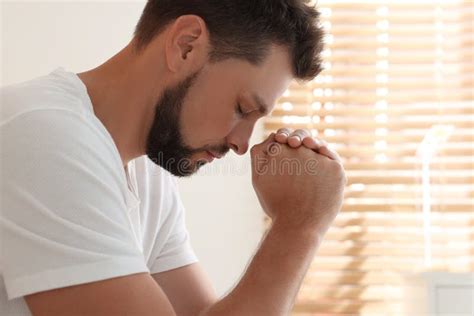 Religious Man With Clasped Hands Praying Indoors Stock Photo Image Of