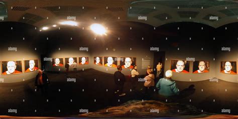 360° view of „Testament“ conceptual piece of prisoner in front of Video