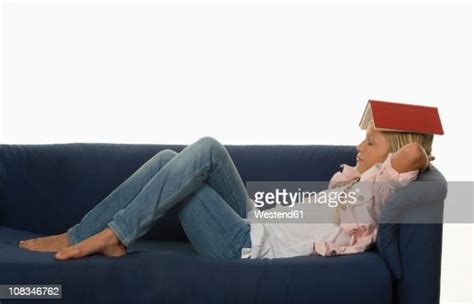 Girl Resting On Couch With Book On Head Photo Getty Images