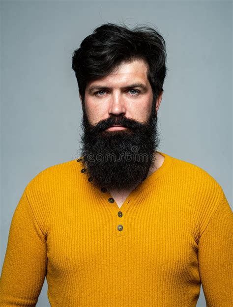 Serious Bearded Man Portrait Looks Seriously Isolated On Gray Stock