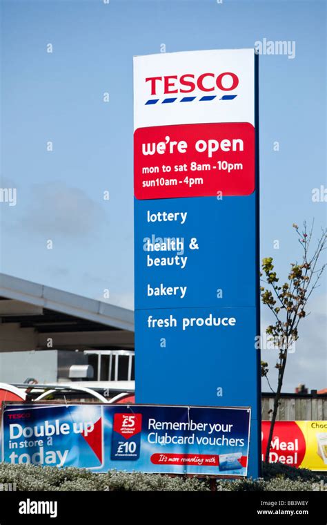 Tesco Stores Sign Showing The Logo And Services Available Uk Stock