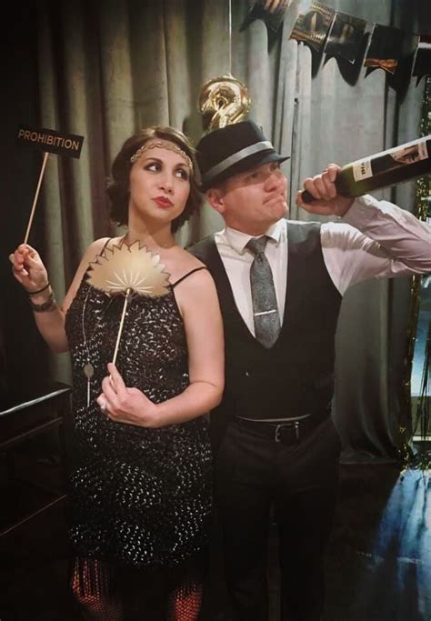 1920s couples costume or roaring twenties flapper and gangster costumes party photobooth
