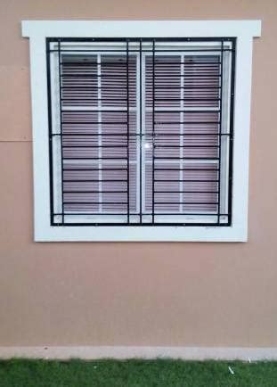 Square grilled framed on window works perfect for classic look in classy french windows. dogcage, window grills,gate and home service ironworks ...