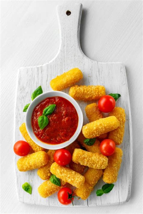 Breaded Mozzarella Cheese Sticks With Tomato Basil Sauce Stock Image