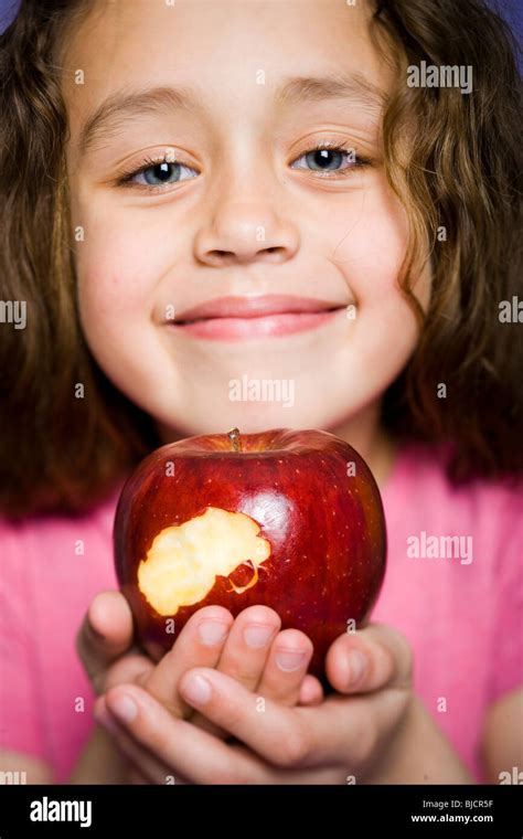Girl Eating Apple Stock Photo Alamy